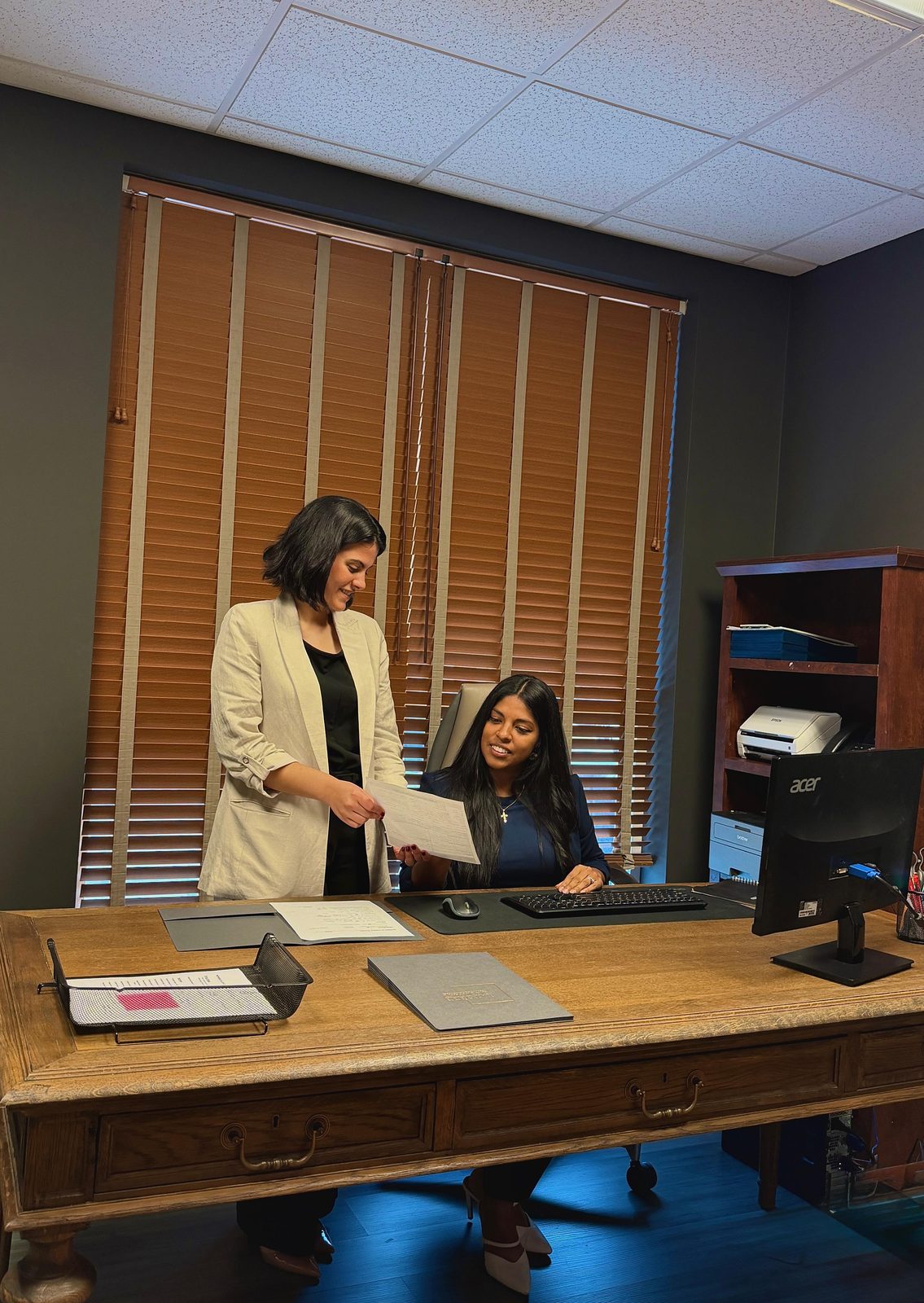 Latorre & Company staff meeting with a client in the Matthews office